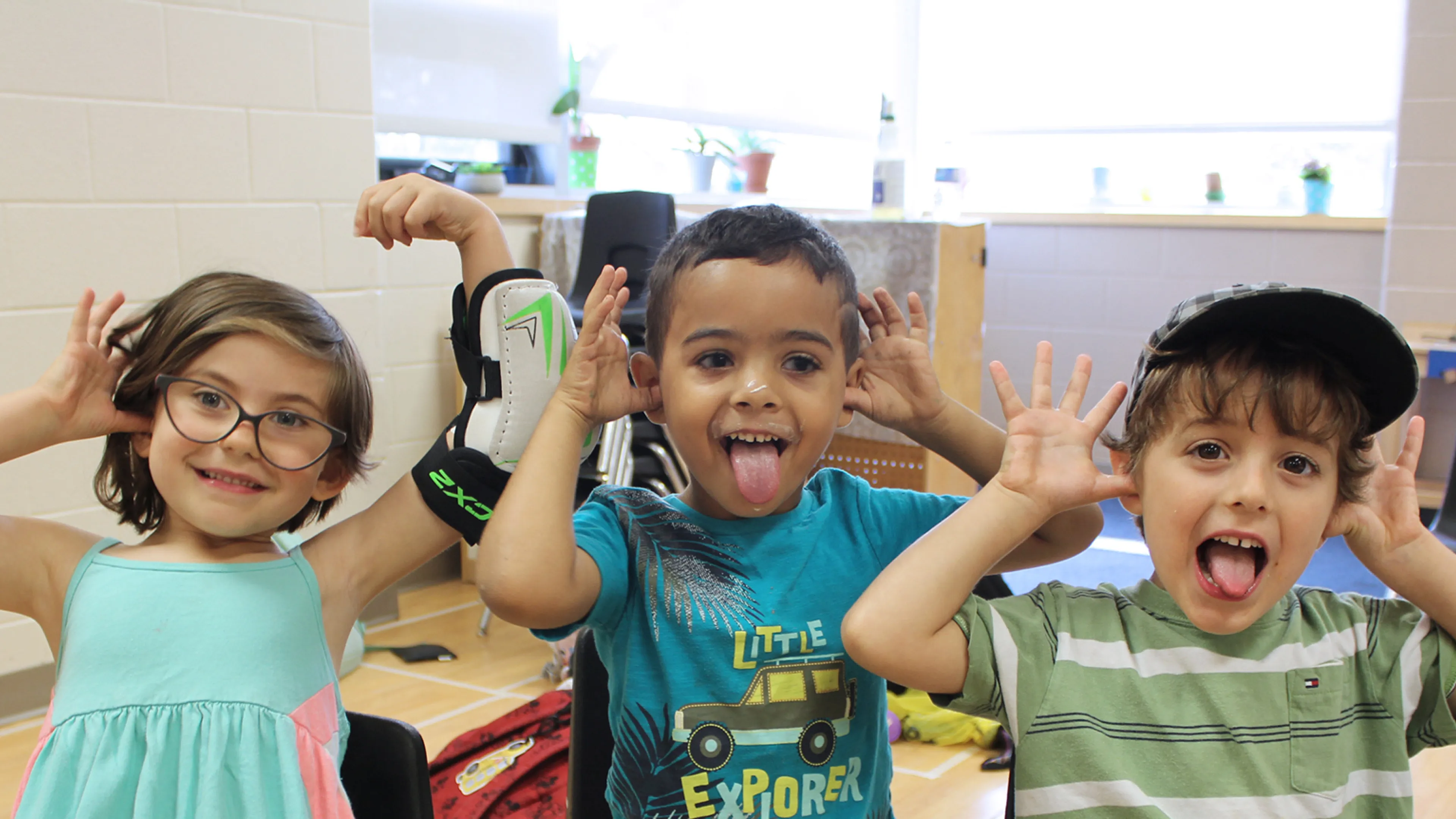 Group of campers smiling and silly posing for camera