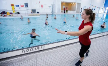 Female Instructor leading an Aquafit class in pool